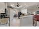 Bright kitchen with granite countertops, a breakfast bar, and views of the dining area at 2375 Fairskies Dr, Spring Hill, FL 34606