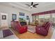 Spacious living room with comfortable furniture, a ceiling fan, and stylish decorations at 2375 Fairskies Dr, Spring Hill, FL 34606