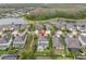 Aerial view of a community with lake, walking paths, and houses at 2596 Whittler Br, Odessa, FL 33556