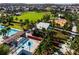 A beautiful community offers a large pool, basketball court, playground, and a lush green field for outdoor activities at 2596 Whittler Br, Odessa, FL 33556