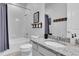 Bathroom with granite countertops, tiled shower, and modern fixtures at 2596 Whittler Br, Odessa, FL 33556
