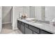 Elegant bathroom featuring granite countertops and dual sinks at 2596 Whittler Br, Odessa, FL 33556
