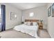 Bright bedroom features neutral decor, white bedding, and modern accents at 2596 Whittler Br, Odessa, FL 33556