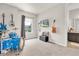 Bedroom with an electric blue drum set, tv, and assorted guitars at 2596 Whittler Br, Odessa, FL 33556