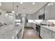 Spacious kitchen featuring granite countertops, stainless steel appliances, and ample cabinetry at 2596 Whittler Br, Odessa, FL 33556