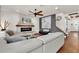 Cozy living room with stone fireplace, hardwood floors, and modern furnishings at 2596 Whittler Br, Odessa, FL 33556