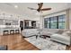 Bright living area with hardwood flooring, modern decor, and open layout at 2596 Whittler Br, Odessa, FL 33556
