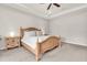 Main bedroom featuring neutral tones, tray ceilings, a ceiling fan, and natural light at 2596 Whittler Br, Odessa, FL 33556