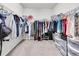 Walk-in closet with metal shelving and rods, providing ample storage and organization space at 2596 Whittler Br, Odessa, FL 33556