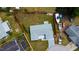 Aerial view of the property highlighting the lot size, landscaping, and proximity to waterfront at 2620 Baltic Pl, Holiday, FL 34691
