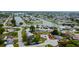 An aerial view of a waterfront home with a private boat lift offering easy access to open waters at 2620 Baltic Pl, Holiday, FL 34691