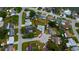 An overhead view highlights the house in a serene neighborhood, featuring a cul-de-sac and well-maintained surroundings at 2620 Baltic Pl, Holiday, FL 34691