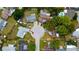 An aerial view shows the property's location in a cul-de-sac surrounded by lush greenery and neighboring houses at 2620 Baltic Pl, Holiday, FL 34691