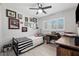 Well-lit bedroom with hardwood floors and sports memorabilia at 319 S Glen Arven Ave, Temple Terrace, FL 33617