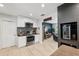 Modern kitchen offering stainless steel appliances and bar top, open to the living area at 319 S Glen Arven Ave, Temple Terrace, FL 33617