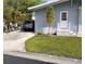 A well-manicured lawn and home's covered carport at 34135 Brown Bayou, Wesley Chapel, FL 33543