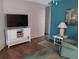 Open living room area with a TV and contemporary decor at 34135 Brown Bayou, Wesley Chapel, FL 33543