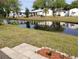 Waterfront homes reflecting in a peaceful canal in this manufactured home community at 34135 Brown Bayou, Wesley Chapel, FL 33543