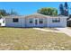 Charming single-story home with a well-maintained front yard and brick walkway at 3622 Cheswick Dr, Holiday, FL 34691