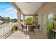 View of patio with seating area, and a view of the canal and homes along the water at 4058 Centavo Ct, Hernando Beach, FL 34607