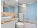 Bathroom featuring vanity with vessel sink, framed mirror, and bath with sliding glass doors at 4058 Centavo Ct, Hernando Beach, FL 34607