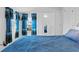 Bright bedroom featuring ocean themed decor, white walls, closet with mirrored doors, and light colored carpet at 4058 Centavo Ct, Hernando Beach, FL 34607