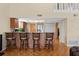 Kitchen with granite countertops, wood cabinets, and seating at the breakfast bar at 4058 Centavo Ct, Hernando Beach, FL 34607