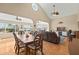 Open-concept living room with tile floors, ceiling fans, and coastal decor in Hernando Beach, Florida at 4058 Centavo Ct, Hernando Beach, FL 34607