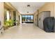 Spacious covered patio featuring neutral tones, outdoor storage, and a view of the property next door at 4058 Centavo Ct, Hernando Beach, FL 34607