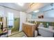 Bathroom features include a step-in shower, linoleum flooring, and a large vanity at 4107 Glissade Dr, New Port Richey, FL 34652