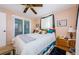 The spacious bedroom features a ceiling fan, window, and closet doors at 4107 Glissade Dr, New Port Richey, FL 34652
