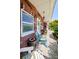 Cozy front porch with brick facade and comfortable seating area at 4107 Glissade Dr, New Port Richey, FL 34652