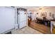 Bright kitchen leading into dining room with wood floors and table at 4107 Glissade Dr, New Port Richey, FL 34652
