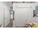 Closet with folding doors and adjacent hall with luxury vinyl plank flooring at 4207 Carlos Ct, Hernando Beach, FL 34607