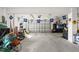 Spacious garage featuring Sunoco and racing decor at 4207 Carlos Ct, Hernando Beach, FL 34607