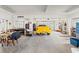 Spacious garage with three bays and a bright yellow SSR at 4207 Carlos Ct, Hernando Beach, FL 34607