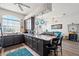 Open kitchen with dark cabinets, granite countertops, an island and views to the living area at 4207 Carlos Ct, Hernando Beach, FL 34607