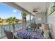 Relaxing covered lanai with a dining table and chairs, perfect for enjoying waterfront views at 4207 Carlos Ct, Hernando Beach, FL 34607