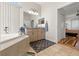 Main bathroom featuring a soaking tub, dual sinks and a walk-in shower at 4207 Carlos Ct, Hernando Beach, FL 34607