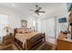 Comfortable bedroom featuring a ceiling fan, slider to porch, and wood flooring at 4207 Carlos Ct, Hernando Beach, FL 34607