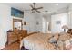 Primary bedroom suite with dresser, ceiling fan, and TV at 4207 Carlos Ct, Hernando Beach, FL 34607