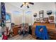 Office with wood desk and vintage roll top desk under arched windows at 4207 Carlos Ct, Hernando Beach, FL 34607