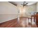 Spacious living room with laminate flooring, white trim, and ample natural light at 4225 La Pasida Ln, New Port Richey, FL 34655