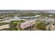 An aerial view of a waterfront condo complex surrounded by lush greenery and waterways at 4516 Seagull Dr # 509, New Port Richey, FL 34652