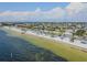 An aerial view of the waterfront beach showing the white sandy beach and clear water at 4516 Seagull Dr # 509, New Port Richey, FL 34652