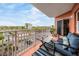 Cozy balcony featuring comfortable seating and panoramic views of the parking and greenery at 4516 Seagull Dr # 509, New Port Richey, FL 34652