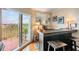 Charming bar area with a rustic countertop, seating, mirror, and access to a balcony with a view at 4516 Seagull Dr # 509, New Port Richey, FL 34652