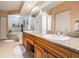 Luxurious bathroom featuring granite countertops, double sinks, a bathtub, and a serene atmosphere at 4516 Seagull Dr # 509, New Port Richey, FL 34652
