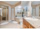 Elegant bathroom with a walk-in shower, soaking tub, granite counters, and sophisticated decor at 4516 Seagull Dr # 509, New Port Richey, FL 34652