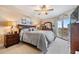 Relaxing main bedroom with balcony access, soft carpet, and comfortable furnishings for rest and rejuvenation at 4516 Seagull Dr # 509, New Port Richey, FL 34652